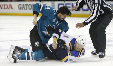 Brenden Dillon, left, fights with Carl Gunnarsson (4) during Game 4 of the West finals ...