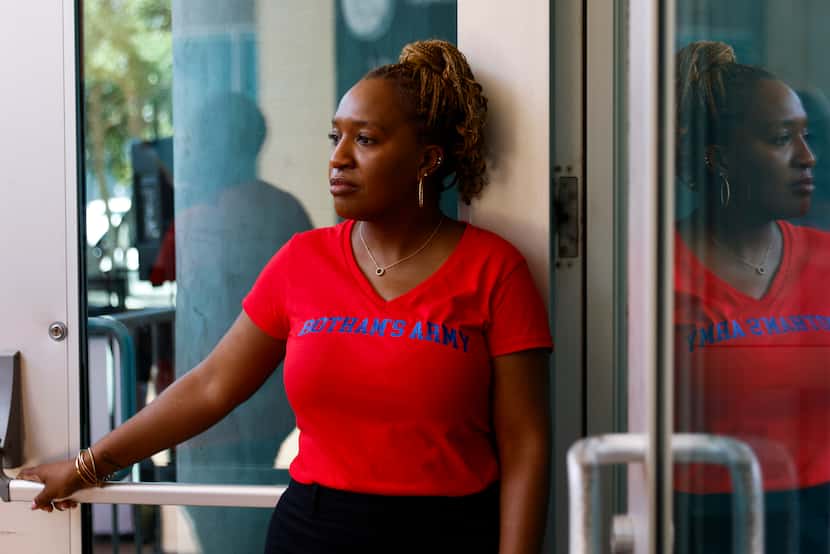 Allisa Charles-Findley, sister of Botham Jean, holds the main entrance door of Dallas Police...