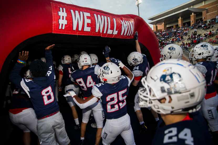 FILE - The Allen Eagles make their way to the field before a game against Cedar Hill on...