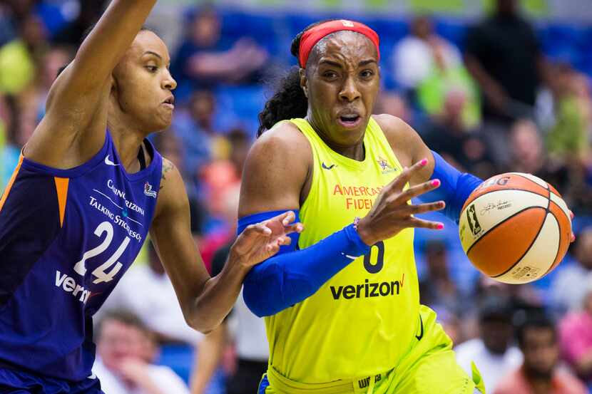 Dallas Wings forward Kayla Thornton (6) gets around Phoenix Mercury forward DeWanna Bonner...