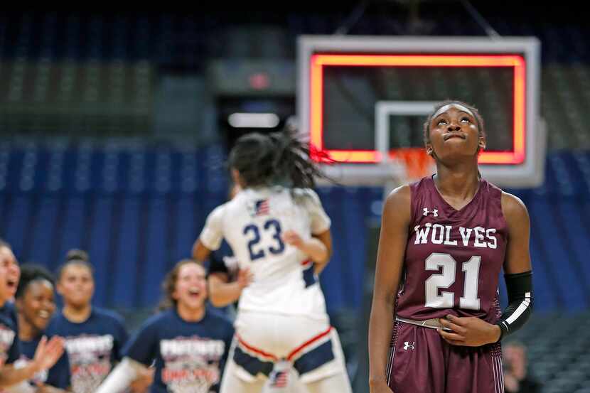 Mansfield Timberview Forward Stephanie Mosley #21 looks up as SA Veterans celebrates in...
