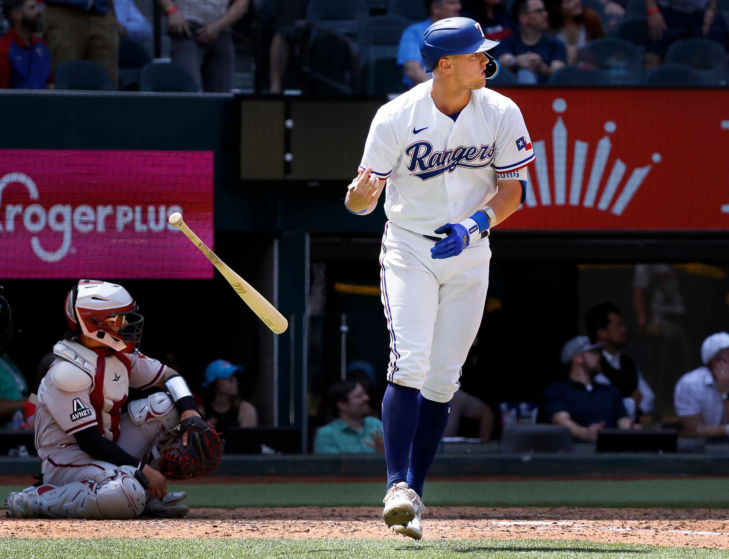 Texas Rangers third baseman Josh Jung (6) flips his bat after a two-run homer during the...