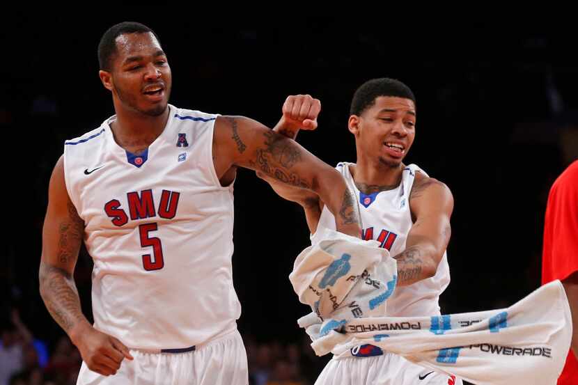 SMU forward Markus Kennedy (5) and guard Keith Frazier (4) celebrated during the second half...
