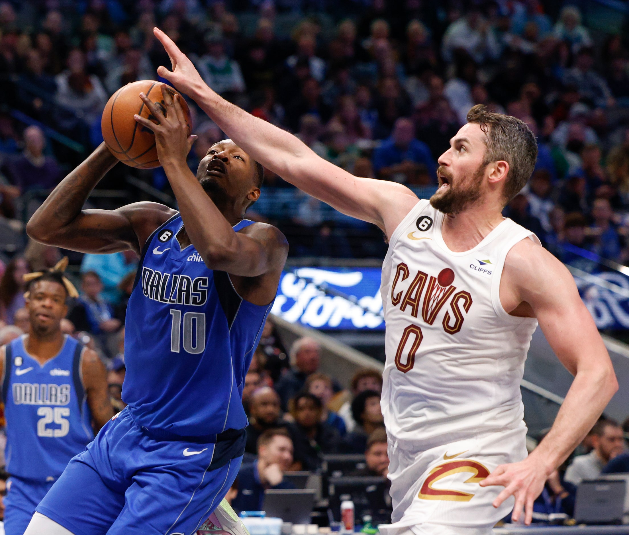 Cleveland Cavaliers forward Kevin Love (0) contests a shot attempt from Dallas Mavericks...