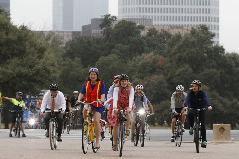 Catherine Cuellar, in the orange-and-yellow vest, rode her bike to City Council in October...