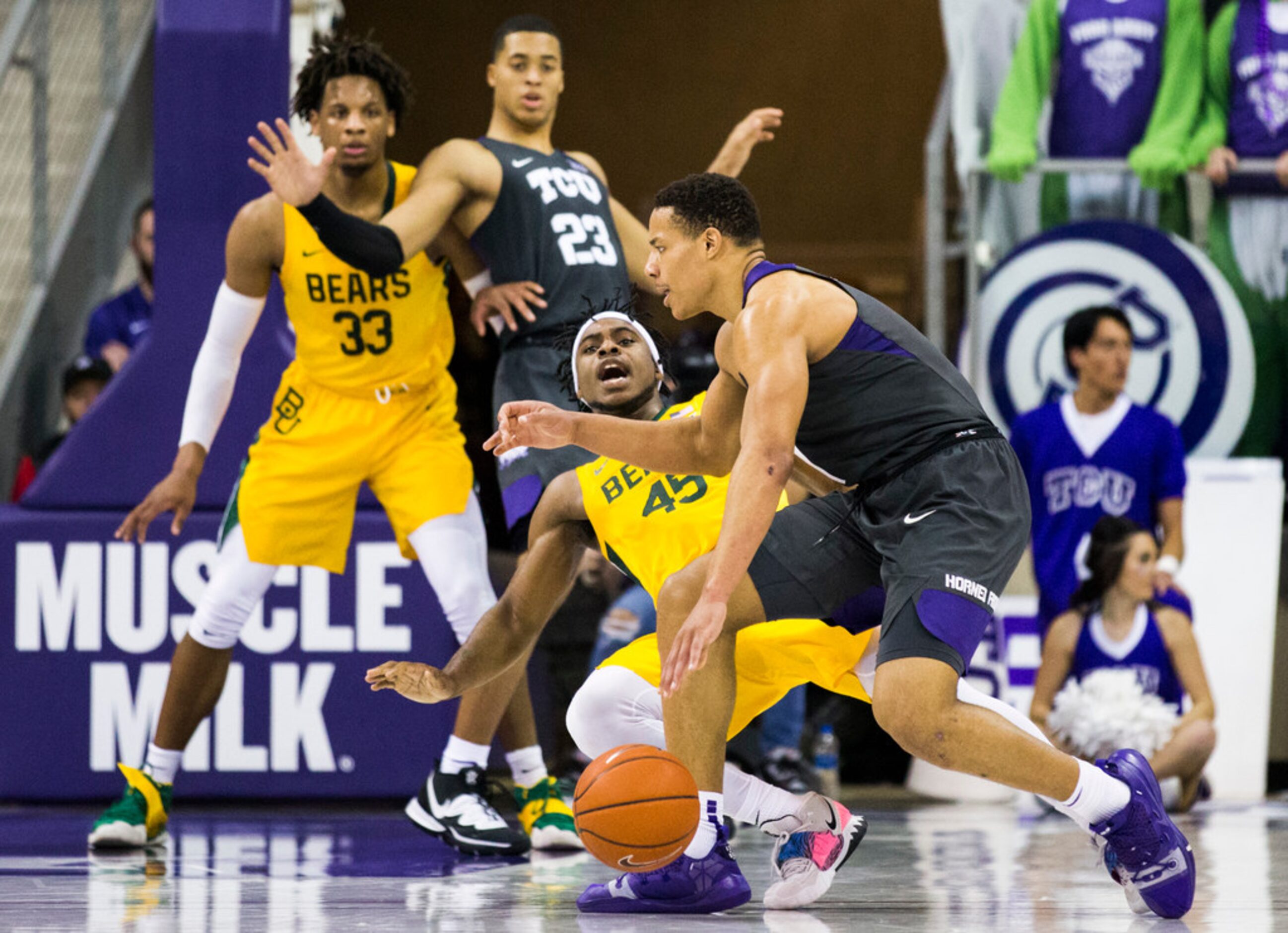 TCU Horned Frogs guard Desmond Bane (1) fouls Baylor Bears guard Davion Mitchell (45) during...