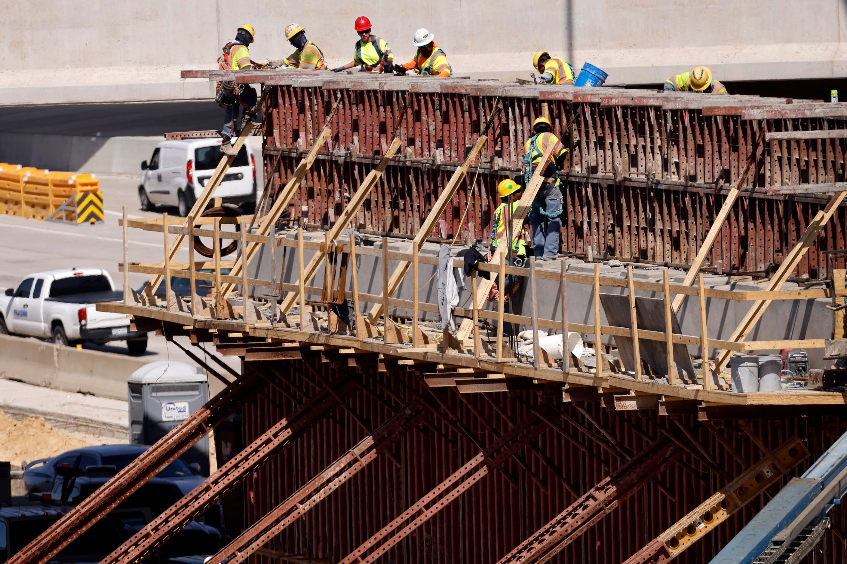 Crews construct a support structure for the $172 million Southern Gateway Park on Interstate...