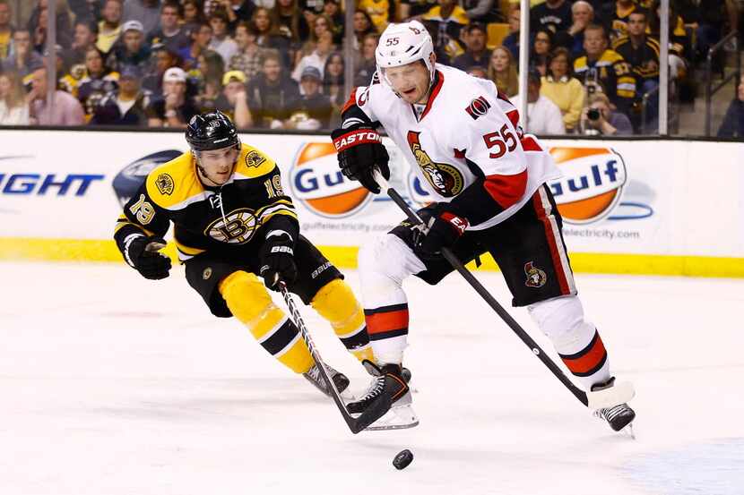 BOSTON, MA - APRIL 28: Sergei Gonchar #55 of the Ottawa Senators carries the puck past Tyler...