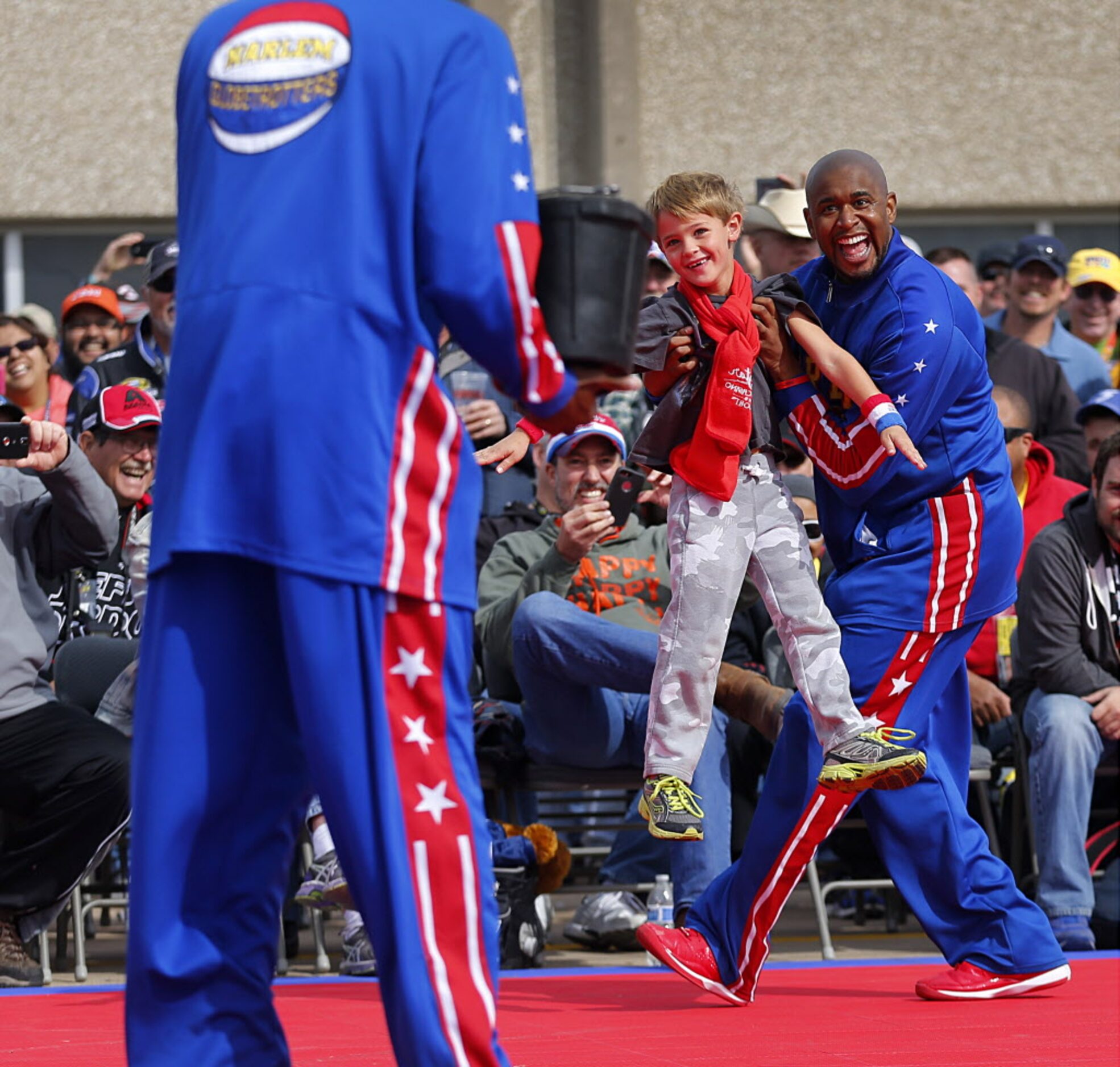 Cole Mansour of Spring, Texas is used a shield from the water trick by Harlem Globetrotters...