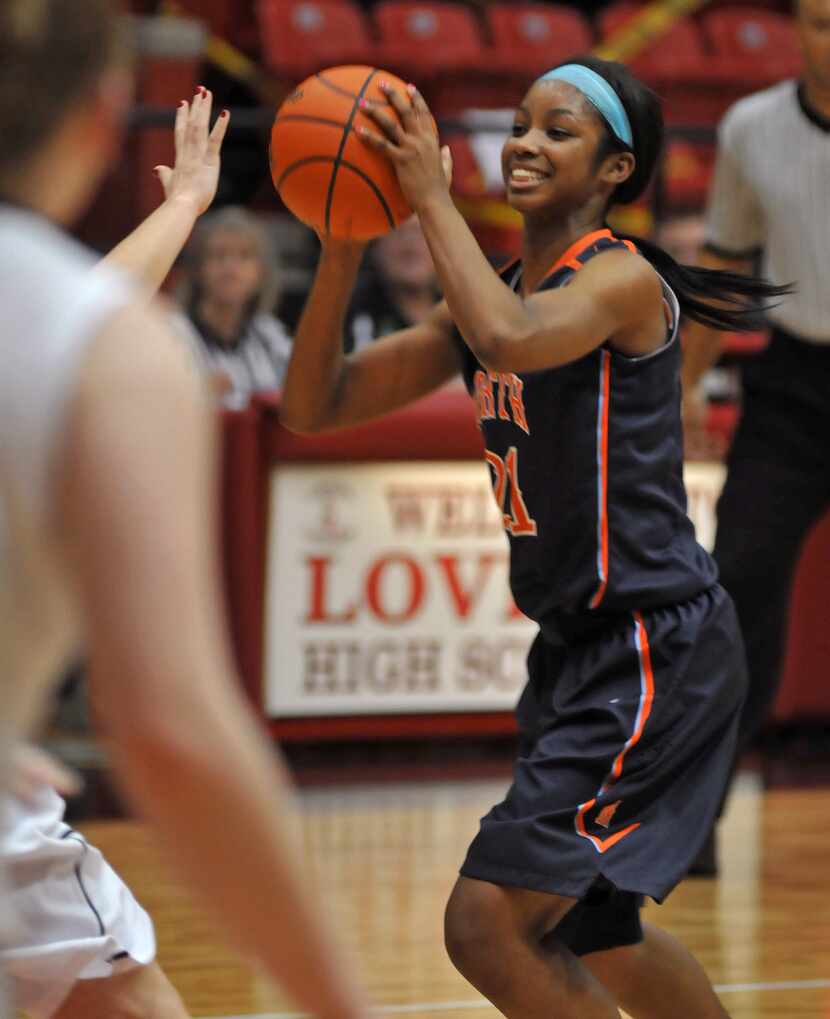 McKinney North junior Chanterria Jackson (21) smiles as she plays against Lovejoy during a...