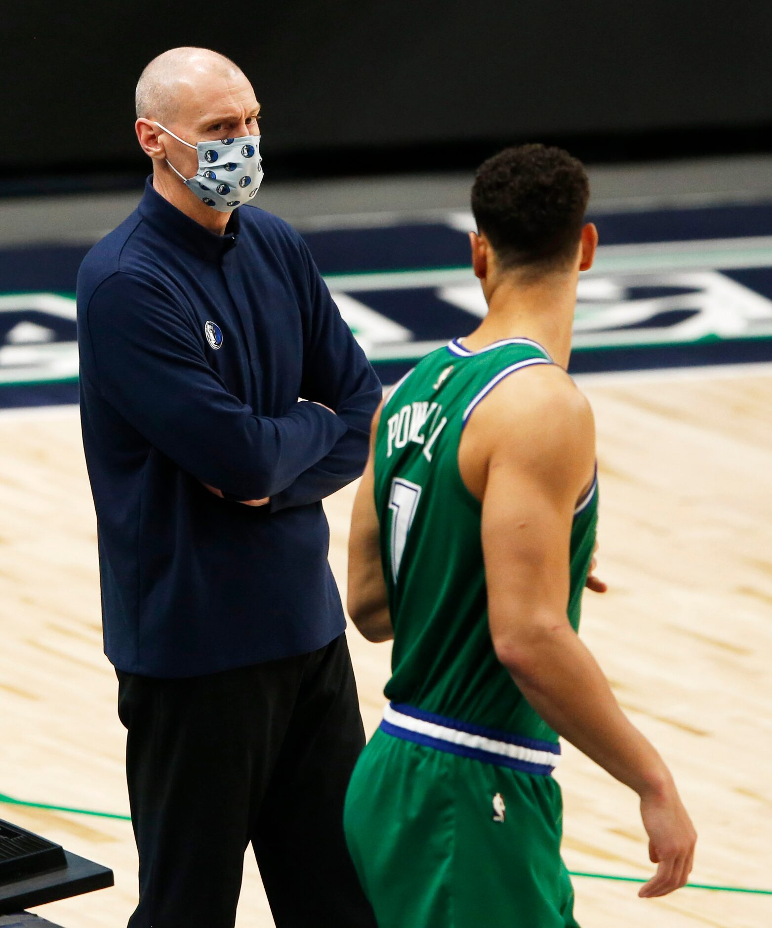 Dallas Mavericks head coach Rick Carlisle talks to Dallas Mavericks center Dwight Powell (7)...