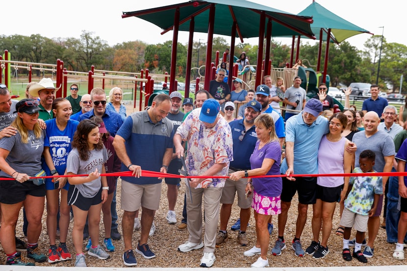 Dale Hansen (center), his wife Chris (right) and others inaugurate a special-needs...