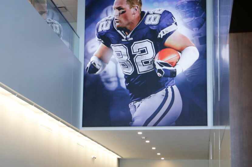 Dallas Cowboys Jason Witten smiles as he makes his way to the players area after looking at...