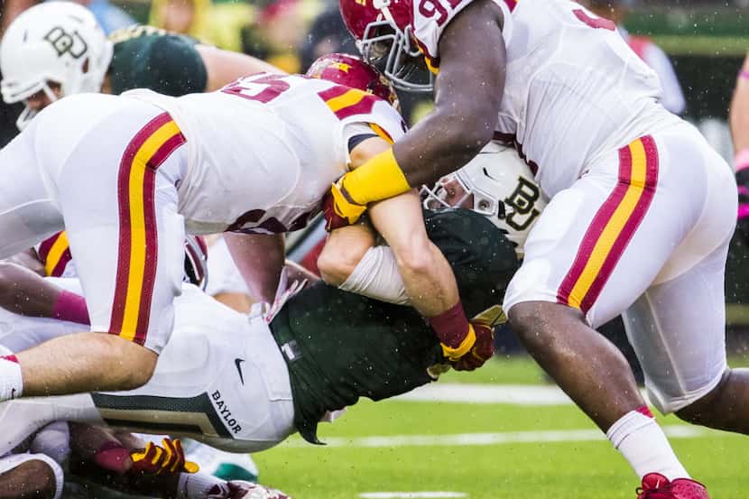 Baylor Bears quarterback Seth Russell (17) is tackled by Iowa State Cyclones linebacker Levi...