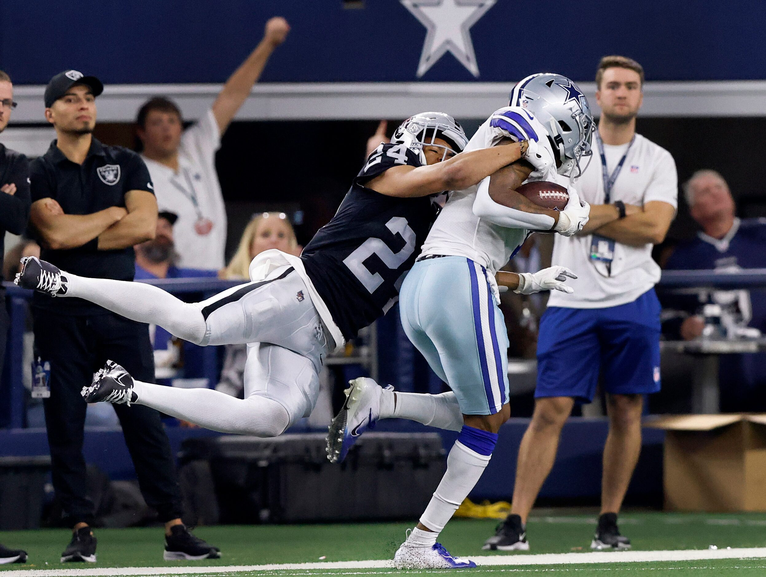 Dallas Cowboys wide receiver Ced Wilson (1) carries Las Vegas Raiders safety Johnathan Abram...