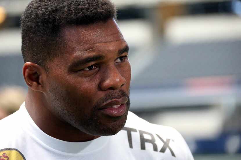 Former Cowboys player Herschel Walker talks with the media as the UFC hosts an open workout...