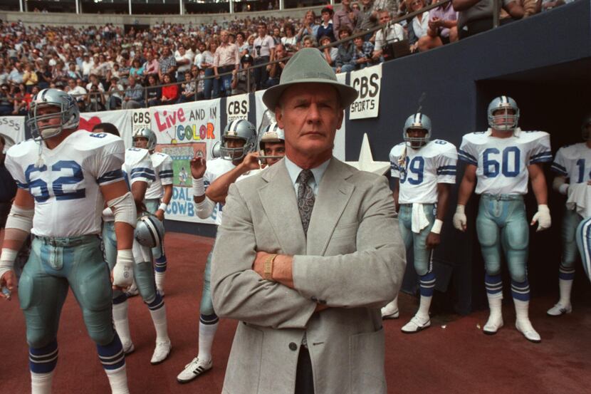 Dallas Cowboys coach Tom Landry waits at the tunnel entrance with the players before a game...