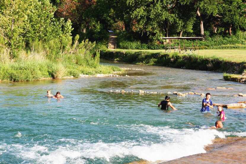 Cooling off  in the South Llano River is fun on a hot summer day.