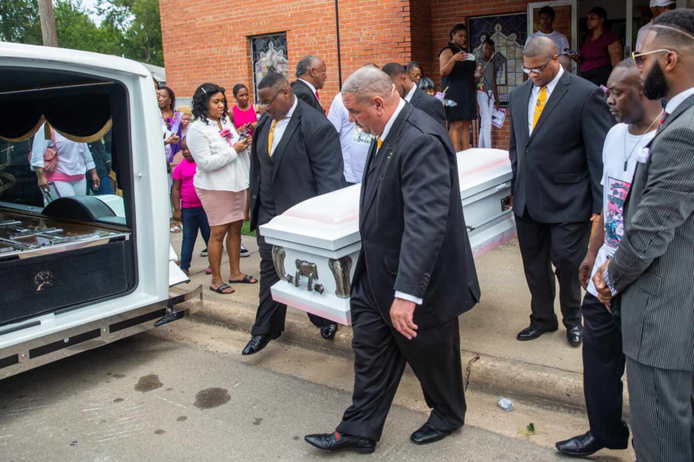 Pallbearers carry the coffin of Brandoniya Bennett after her funeral at New Morning Star...