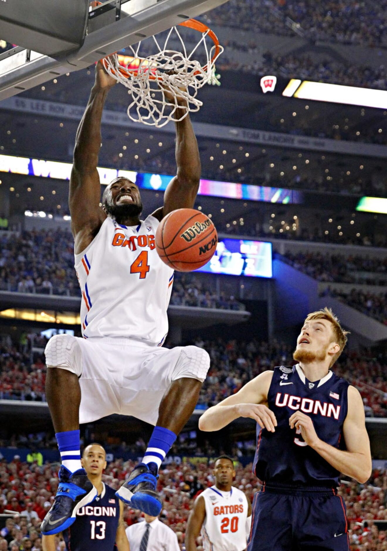 Connecticut Huskies guard/forward Niels Giffey (5) looks on as Florida Gators center Patric...