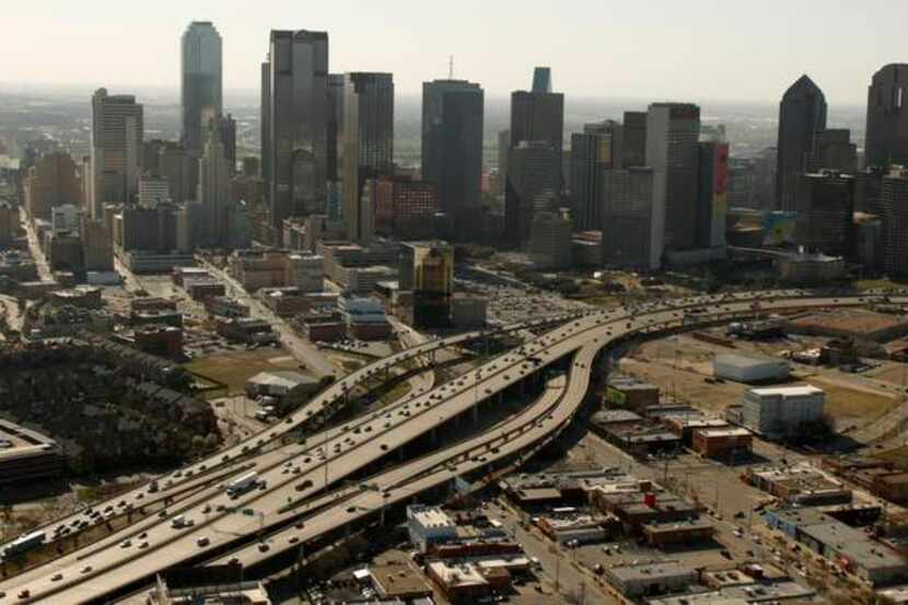 Interstate 345 connects U.S. 75 and Interstate 45 while separating Dallas' downtown (top)...
