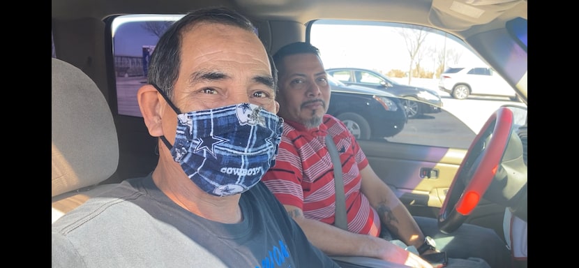 Ines Garcia Sr., left, and son, Ines Garcia Jr., sit in their truck after the father...