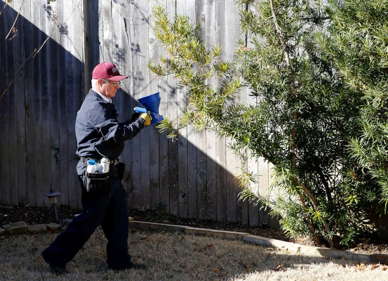 Steve Florsheim of ABC Home and Commercial Services works on preventative pest treatment at...
