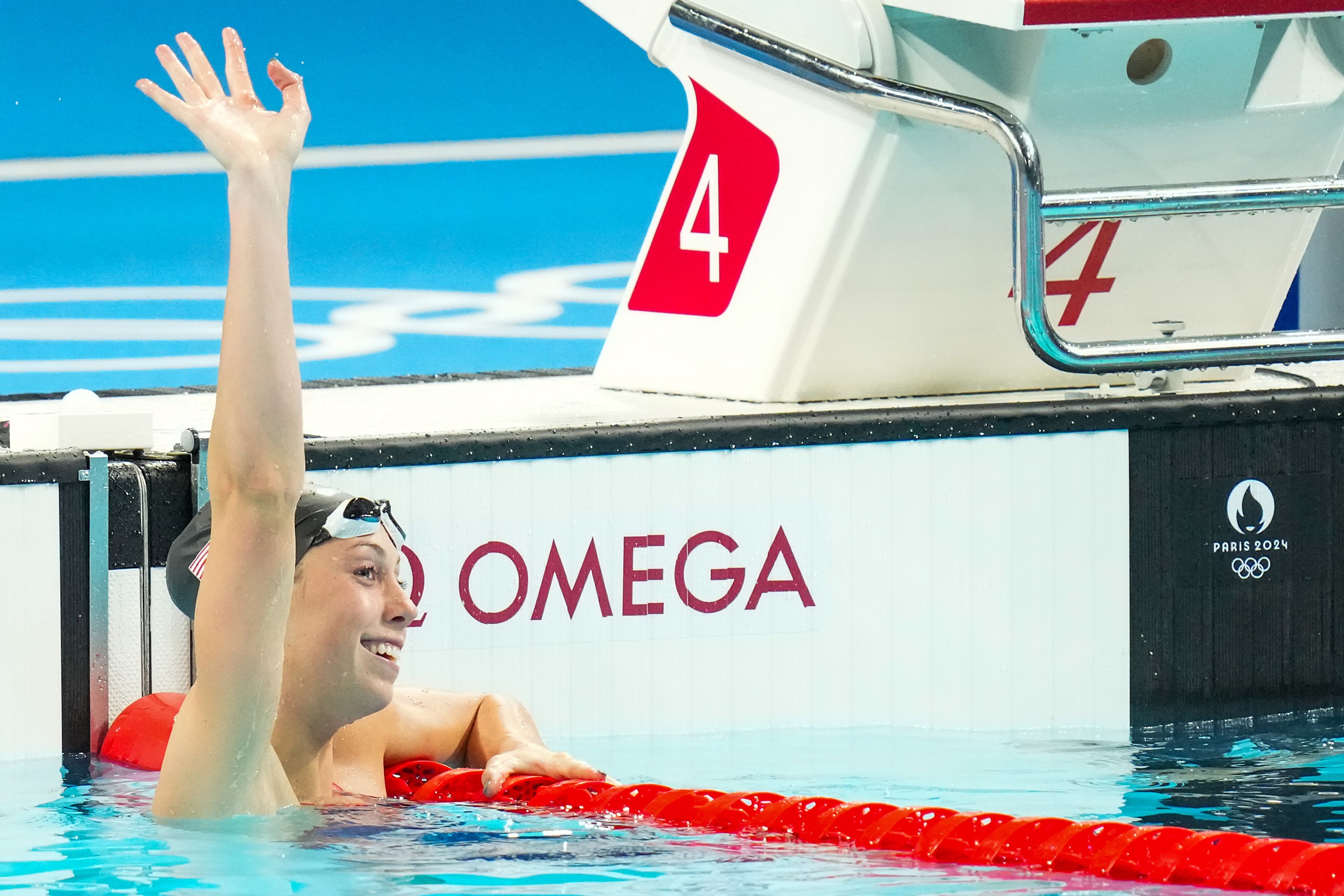 Gretchen Walsh of the United States celebrates after setting the Olympic record with a time...