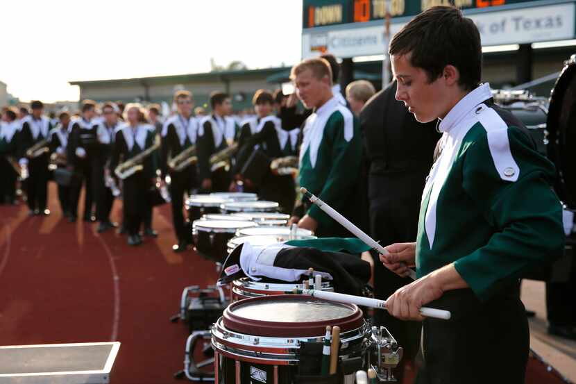 Andy Rolen drums before the game between Waxahachie High School and Ennis High School at...
