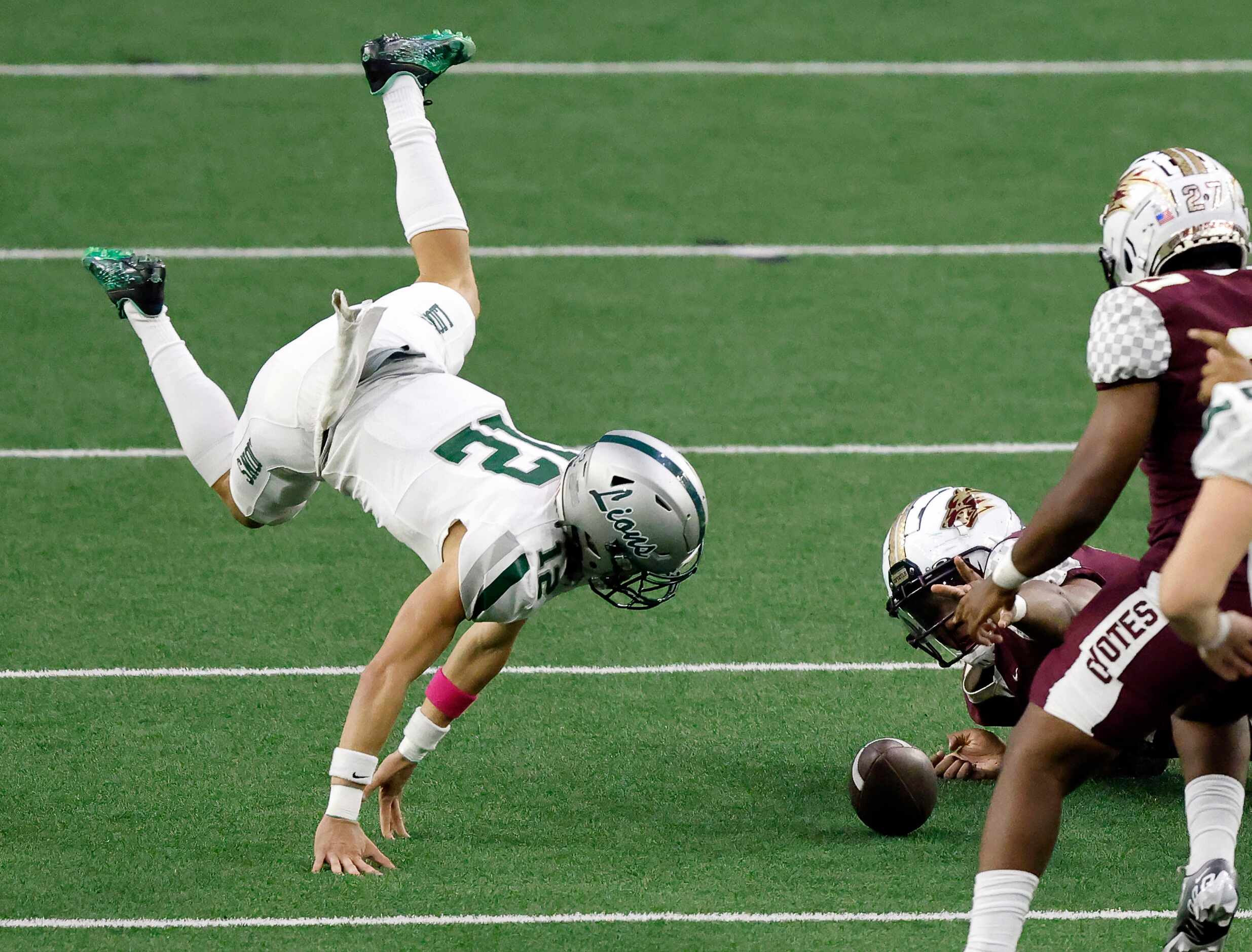 Frisco Reedy quarterback Caleb Deal (12) goes flying after he tried to chase down a high...