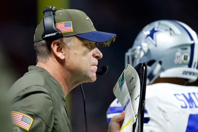 Dallas Cowboys offensive coordinator Scott Linehan watches his squad face the Atlanta...