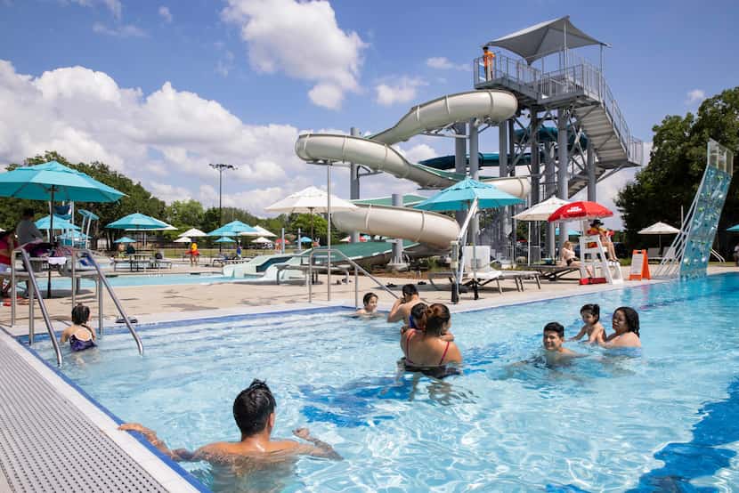 Families enjoy a sunny afternoon at the Cove Aquatic Center at Crawford.