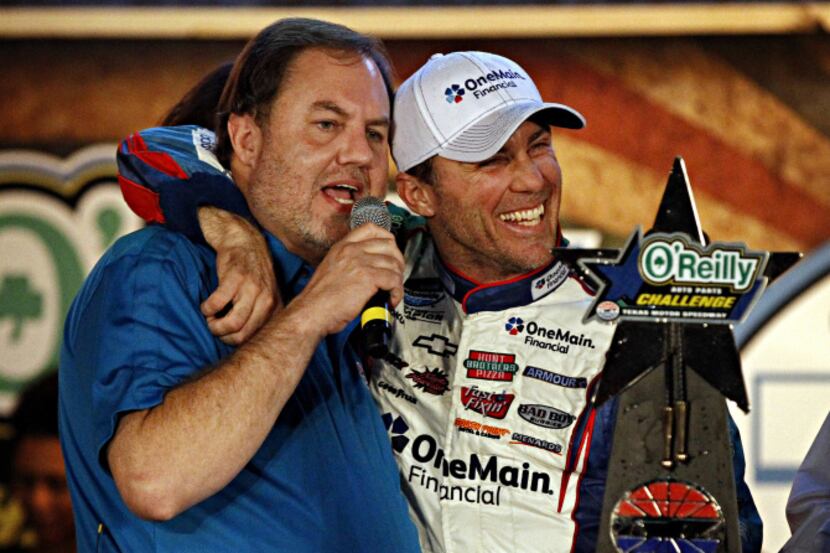 Kevin Harvick (right) hugs Eddie Gossage, president and general manager of Texas Motor...