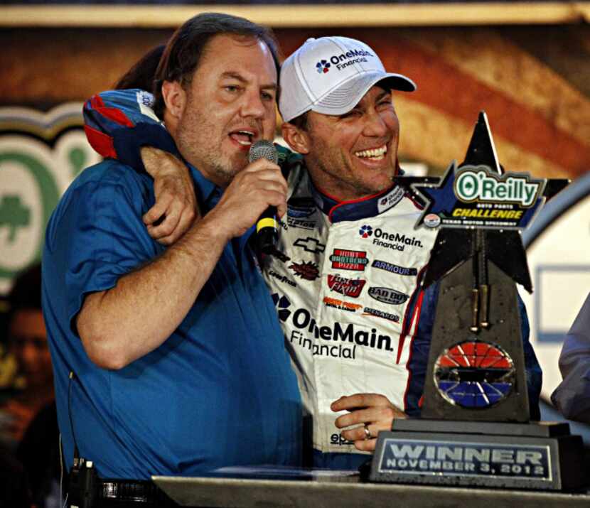 Kevin Harvick (right) hugs Eddie Gossage, president and general manager of Texas Motor...