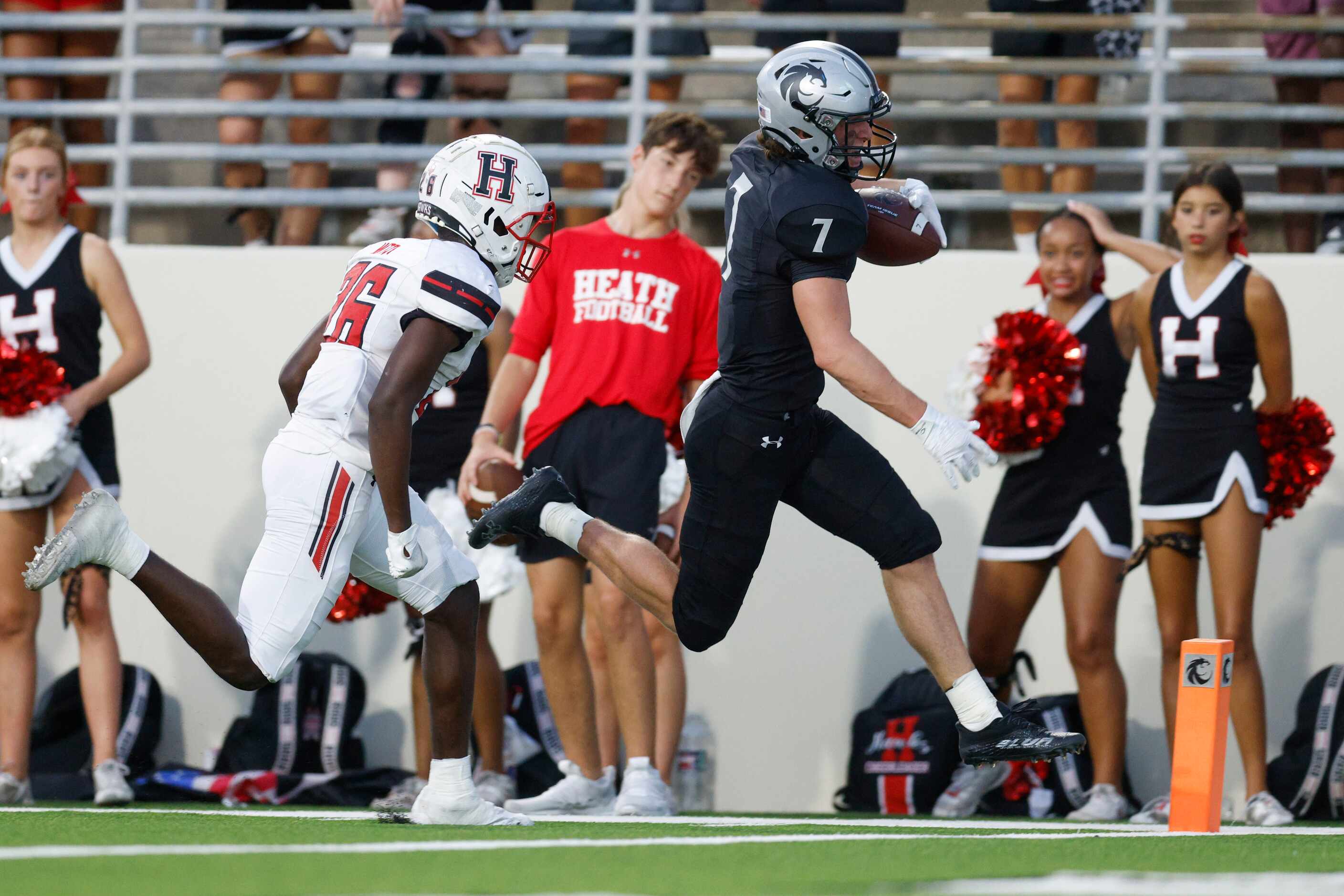 Denton Guyer wide receiver Landon Sides (7) scores a touchdown ahead of Rockwall-Heath...