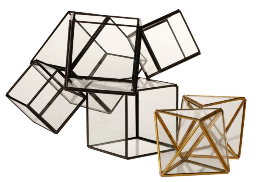 Cubed: Create a tabletop vignette instantly with the Cube, a large, black-finished copper...