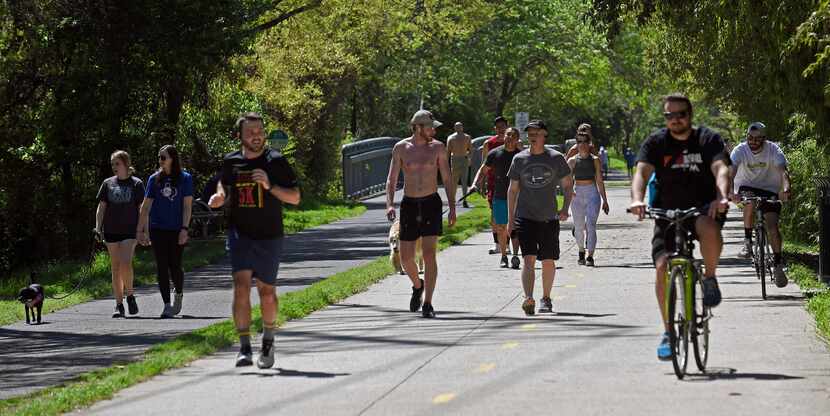 Around 4:30 in the afternoon, groups of runners, cyclists and dog walkers use the Katy Trail...