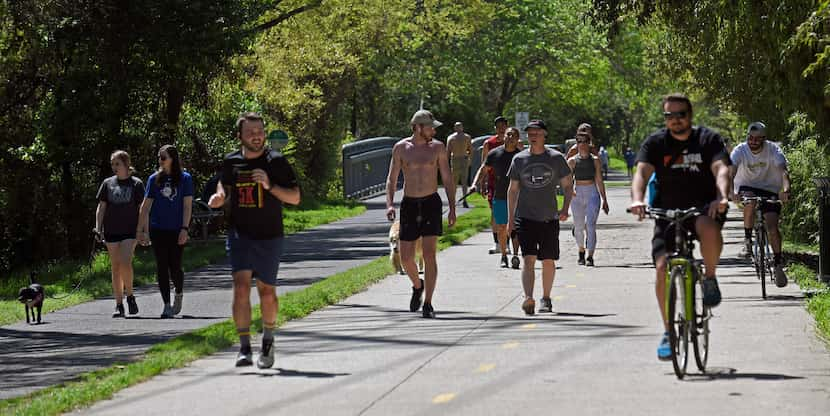 Around 4:30 in the afternoon, groups of runners, cyclists and dog walkers use the Katy Trail...