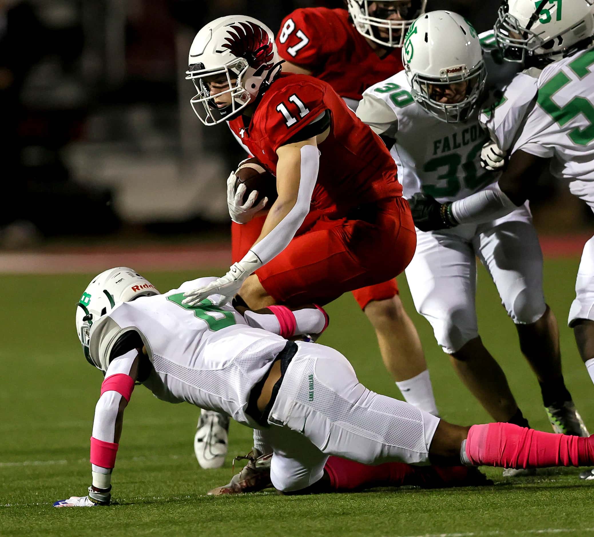 Argyle running back RJ Bunnell (11) tries to avoid getting tackled by Lake Dallas defensive...