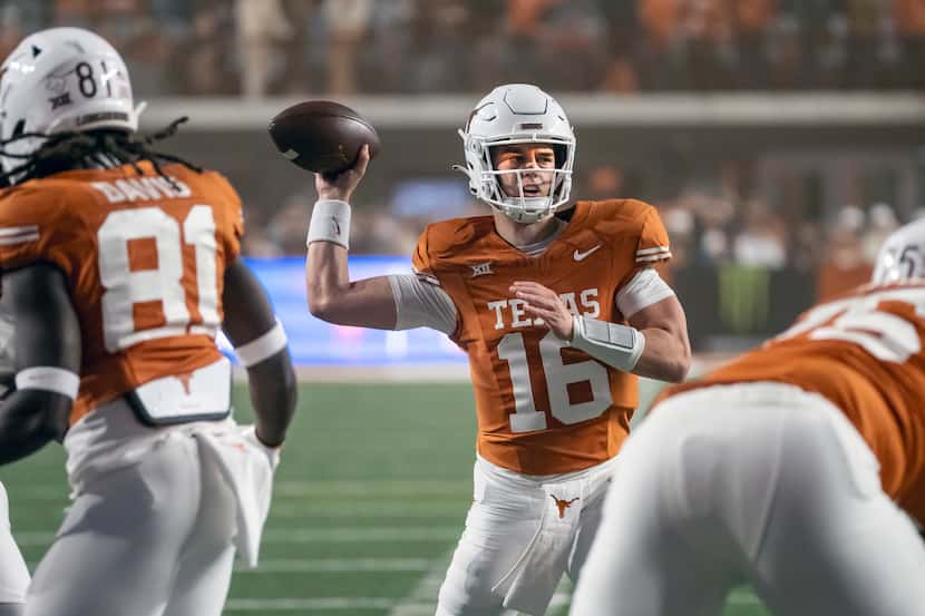 Texas quarterback Arch Manning looks for a receiver during the second half of the team's...