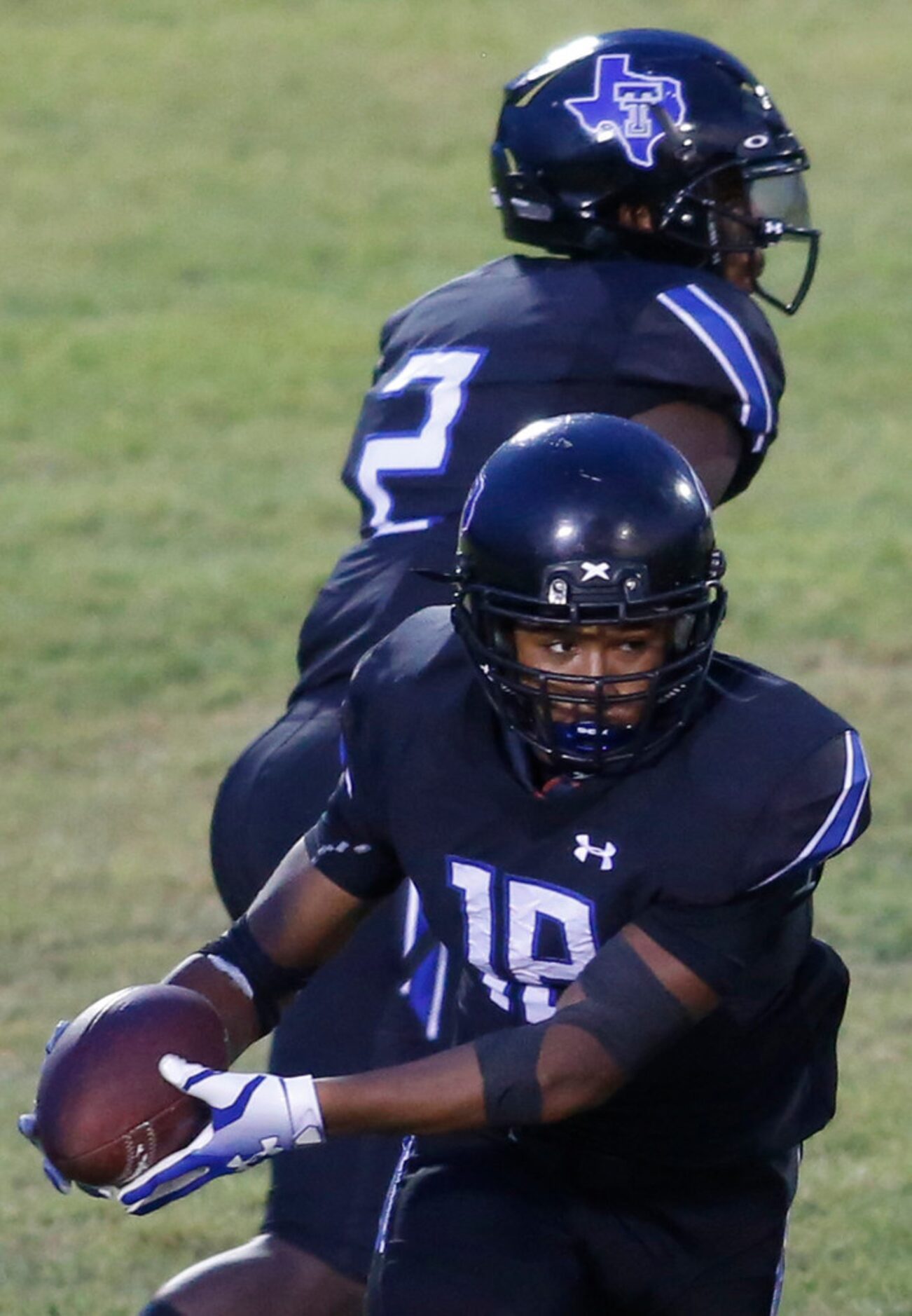 Trinity Christian Cedar Hill running back Emari Matthews (18) takes a handoff from...