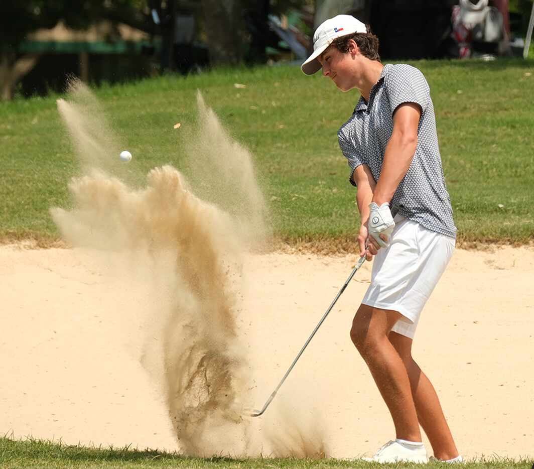Jack Vetere of Mansfield Black hits out of sand trap on Day 2 of the UIL 6A boys golf state...