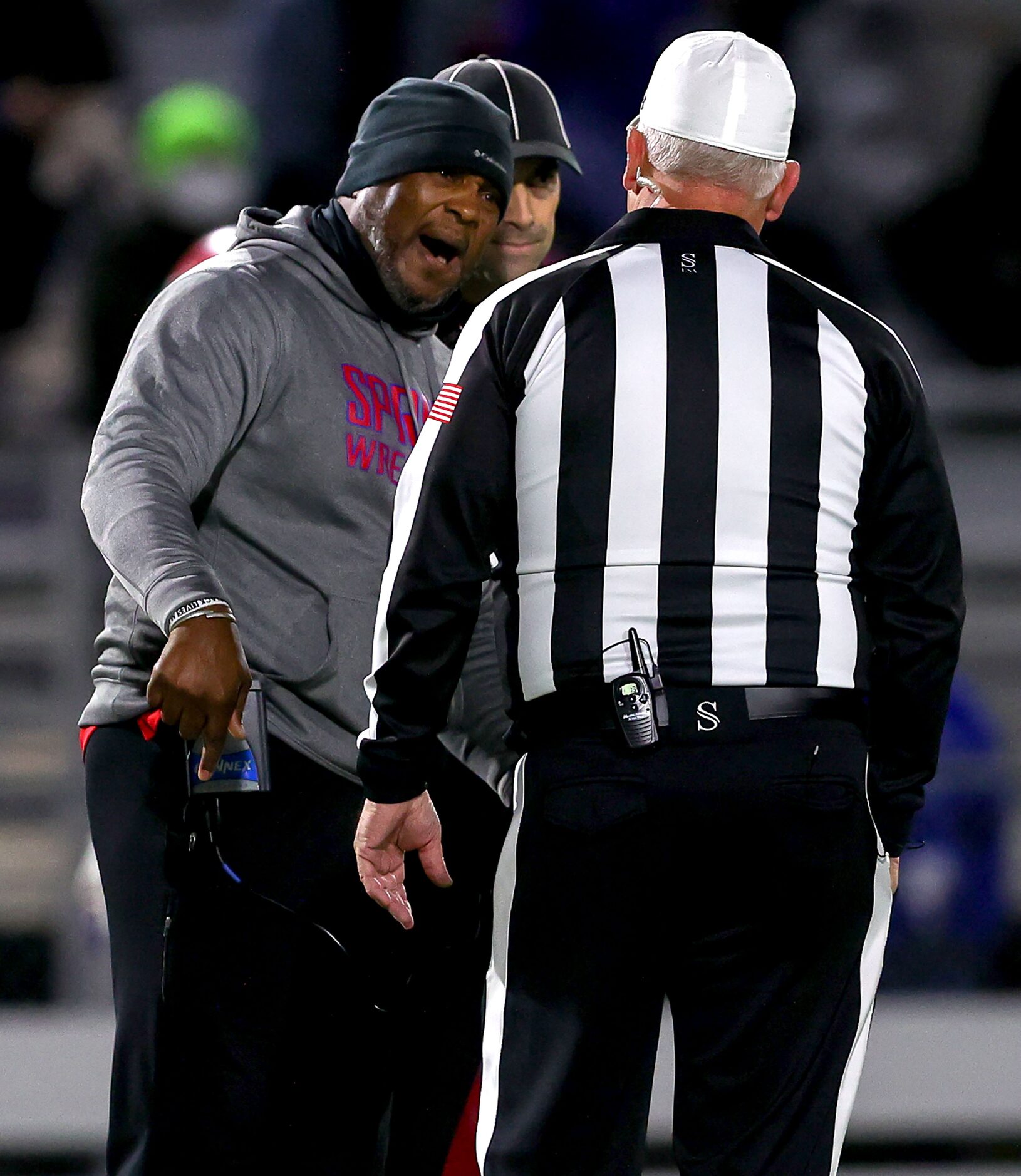 Spruce head coach Carl Richardson Jr argues with the referee during the game against...