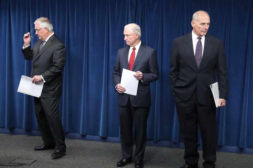 Attorney General Jeff Sessions (C), Secretary of Homeland Security John Kelly (R) and...