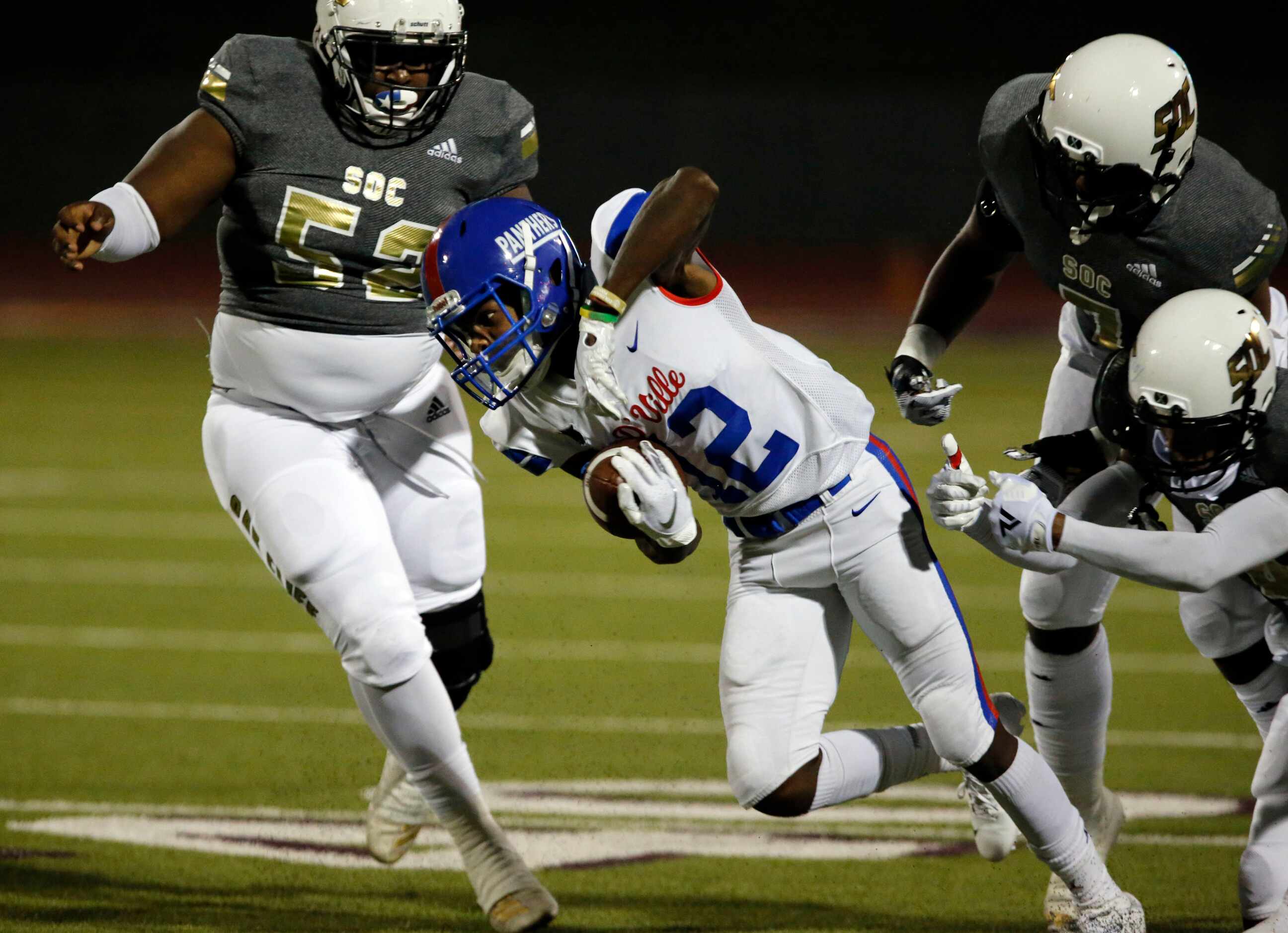 Duncanville’s Da’Myrion Colemman (12) picks up a couple of yards during the first half of...