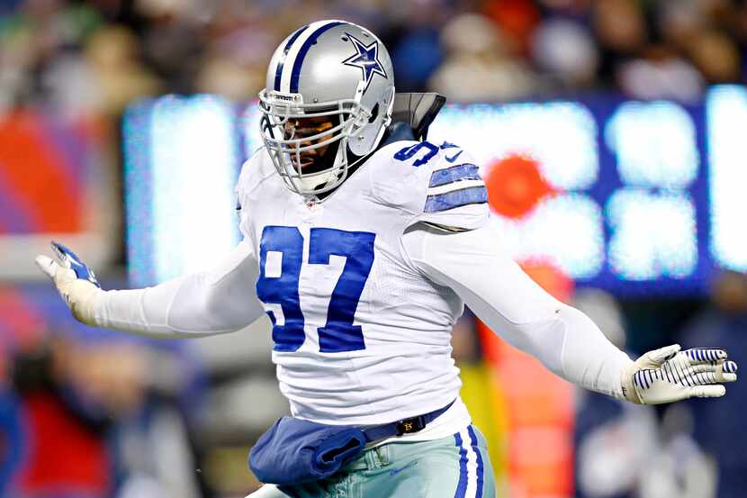 Dallas Cowboys defensive tackle Jason Hatcher reacts after sacking New York Giants...