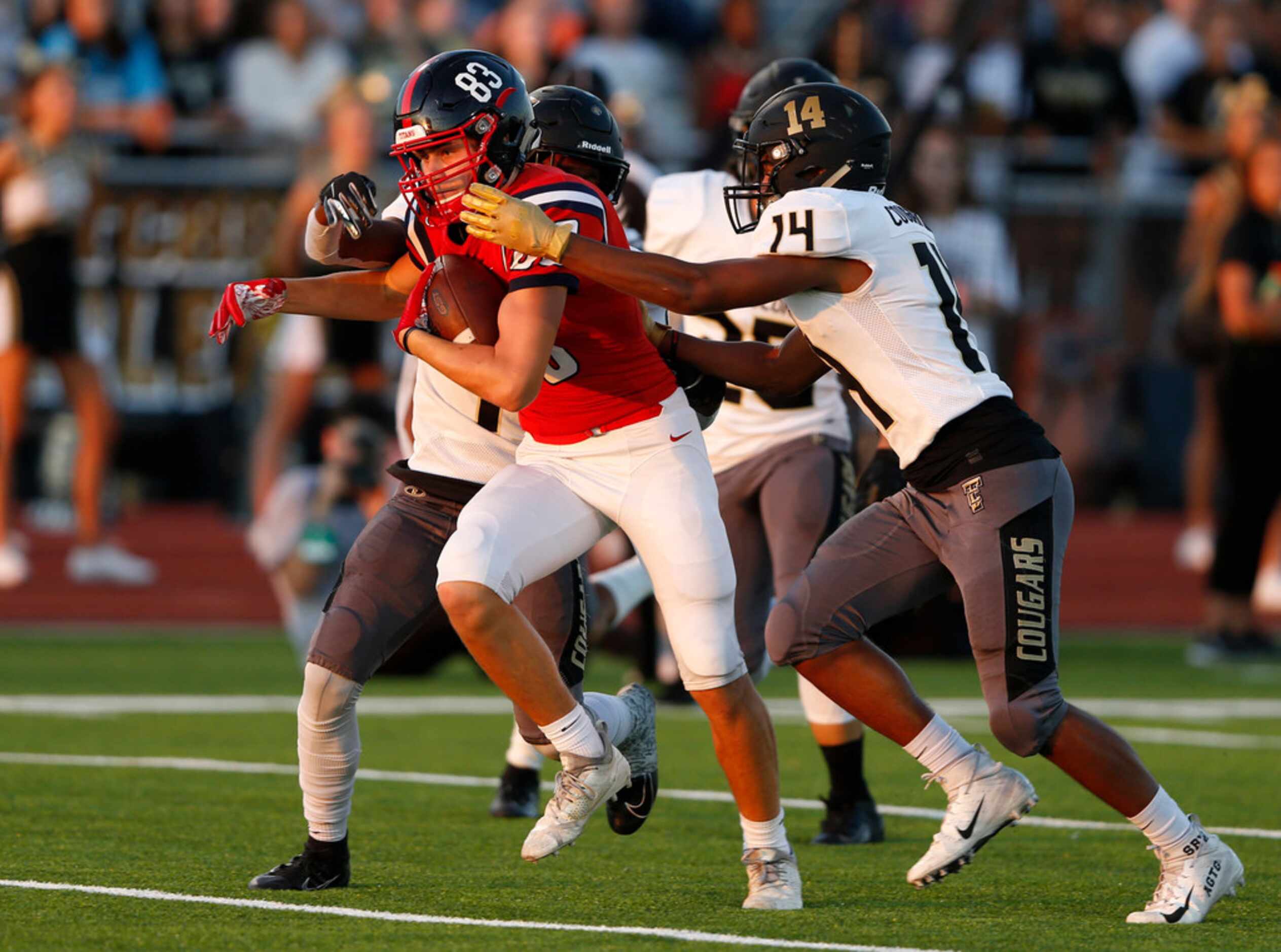 Centennial's Jacob McCoy (83) runs up the field for a touchdown as The Colony's Stephen...