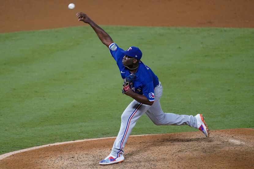 Texas Rangers relief pitcher Demarcus Evans throws during the seventh inning of the team's...
