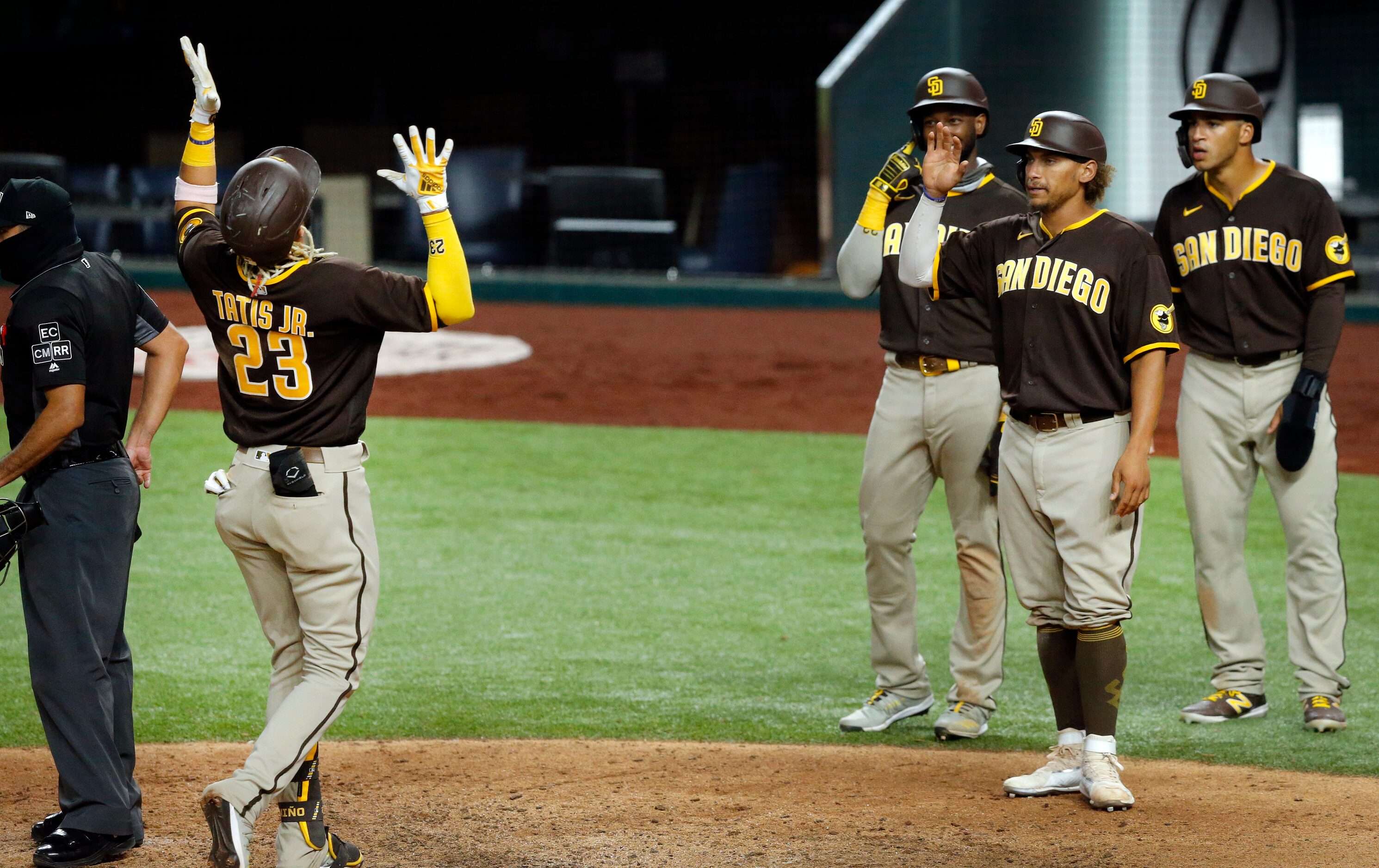 San Diego Padres Fernando Tatis Jr. (23) looks skyward as he crosses home plate following...