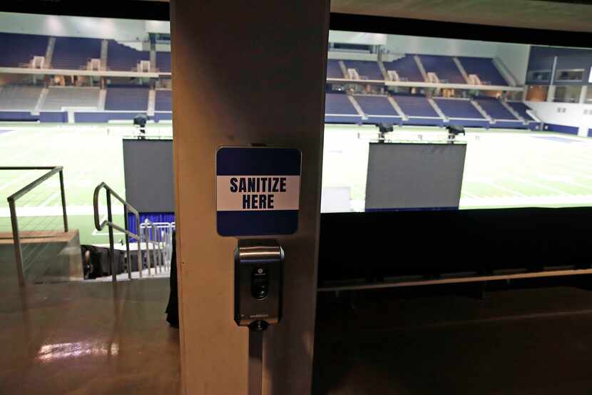 A hand sanitizing station greets Cowboys players and personnel before they step on the field...